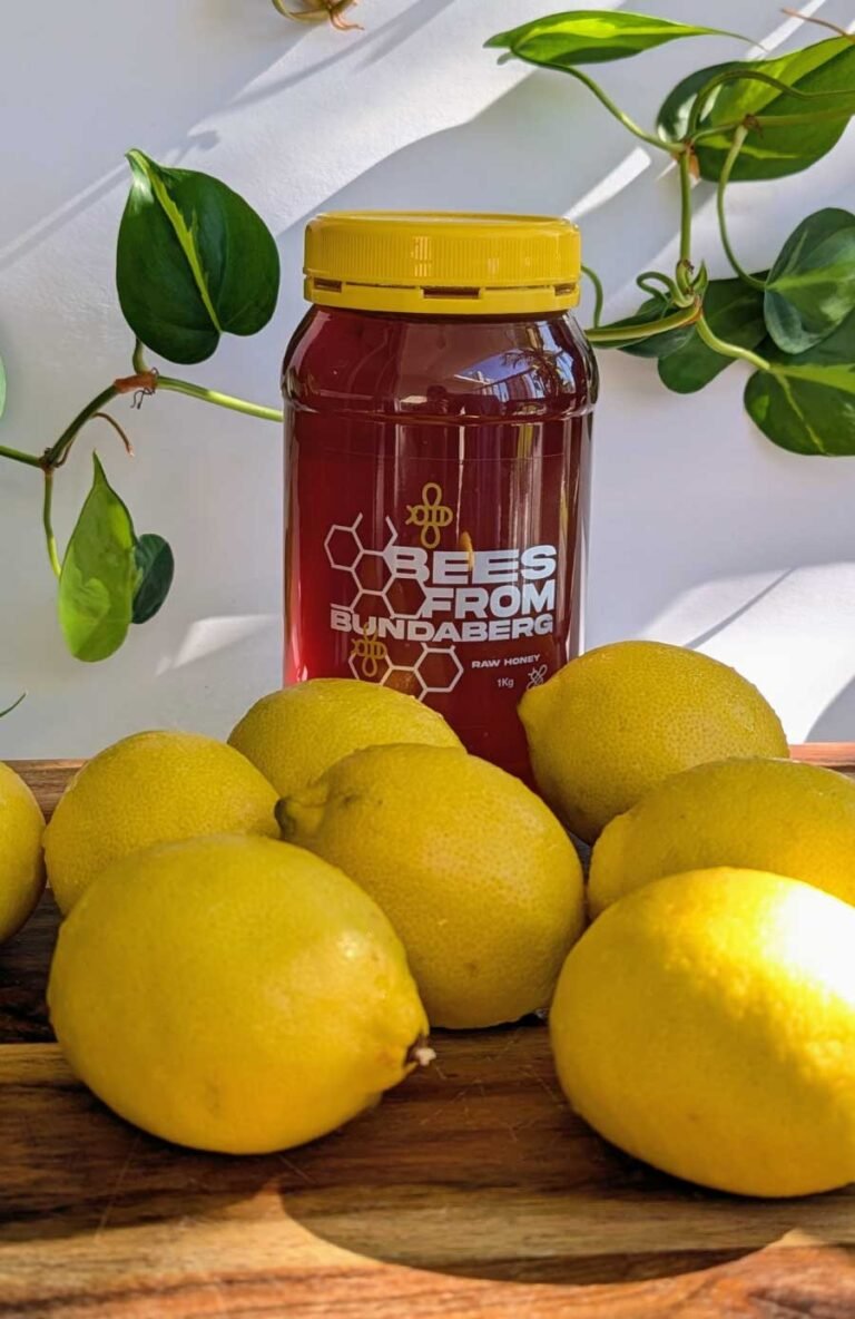 Honey jar with fresh lemons. lemon honey recipe