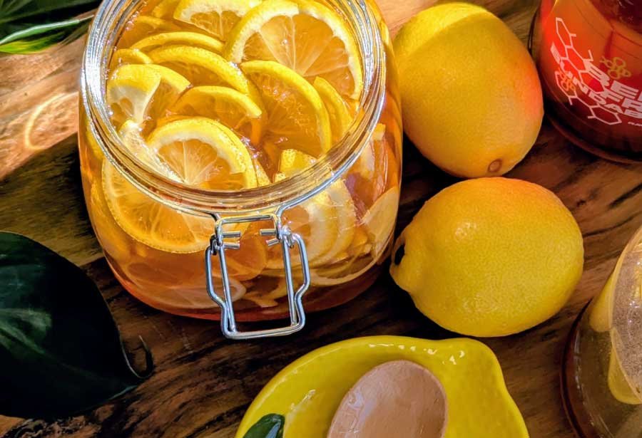 Jar of lemon honey slices and lemons lemon honey recipe